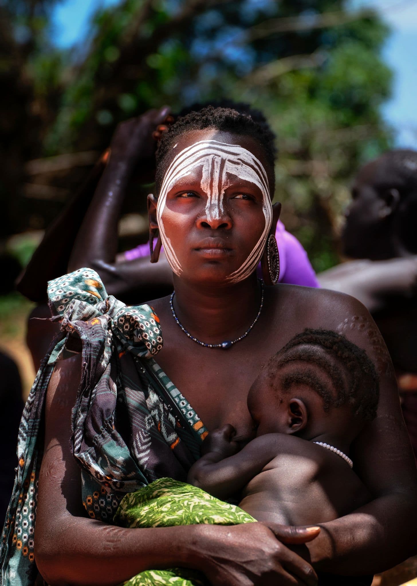 Indigenous tribal people of the Omo Valley in traditional dress and body paint, South Ethiopia